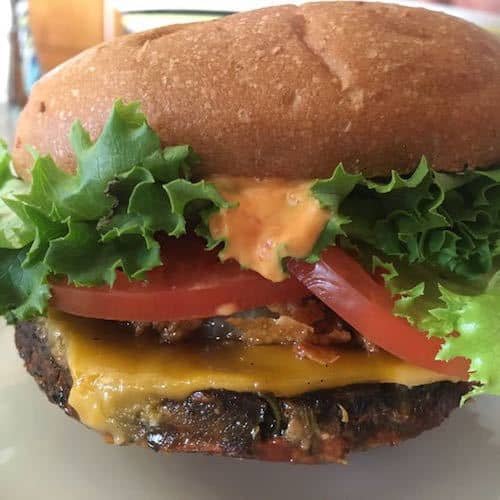 Plant Power Rambler burger, complete with crispy onion rings