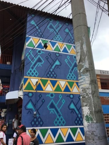 Painted buildings based on designs from the weavings of Santa Catarina Palopó