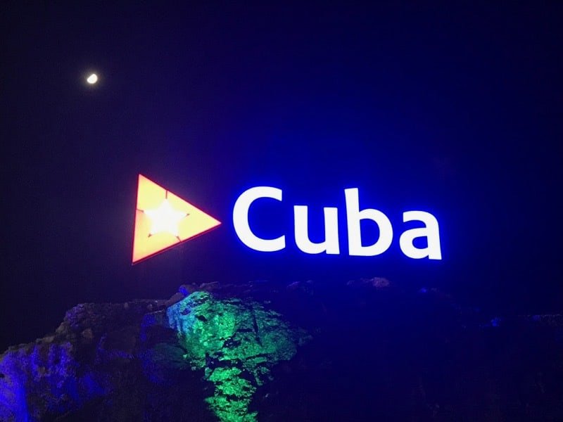 The sign lit up on the hillside above where Avenida 23 meets the Malecón.