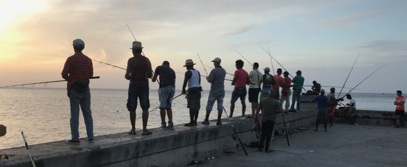 Fishermen on the Malecón, at the entrance to Havana Harbor
