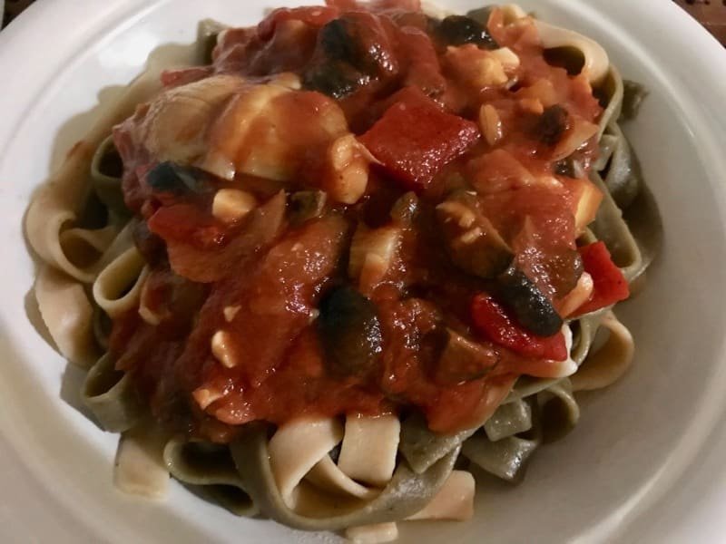 Pasta from Camino al Sol with a homemade sauce featuring artichoke hearts, black olives, and roasted red pepper.