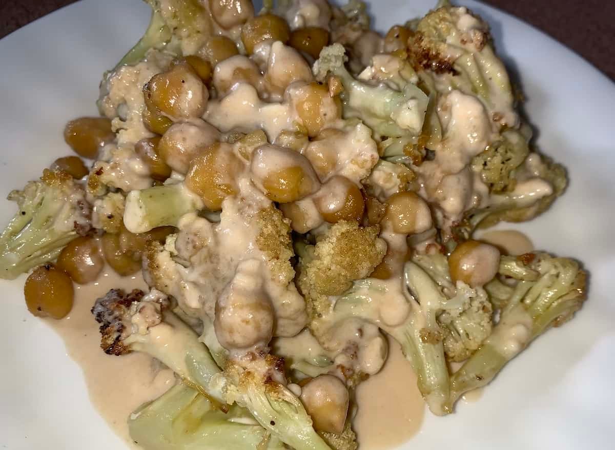 Photo of roasted cauliflower and chickpeas with tahini sauce